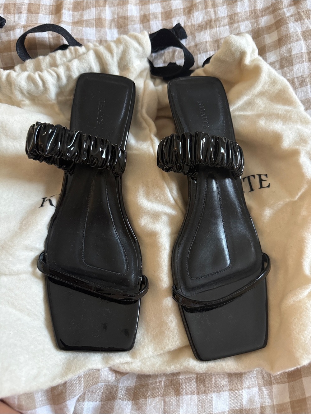 KHAITE Black Patent Leather Square-Toe Ruched Strap Slides